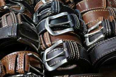 belts of leather for sale in the italian store clipart
