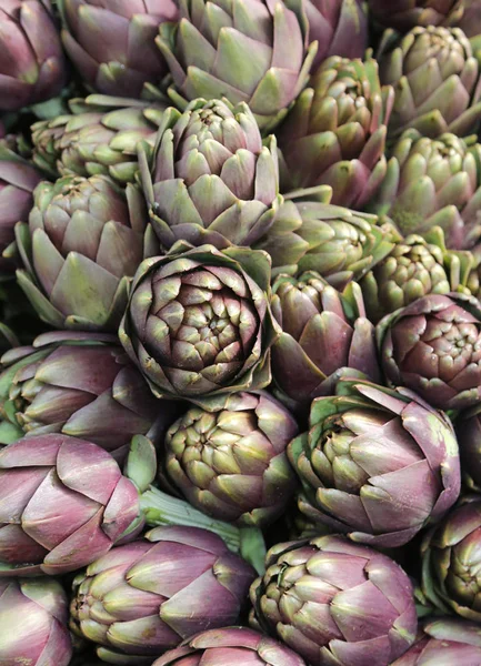 Background of many ripe artichokes — Stock Photo, Image