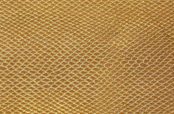 Gyllene bakgrund av skalor liknar ormskinn — Stockfoto