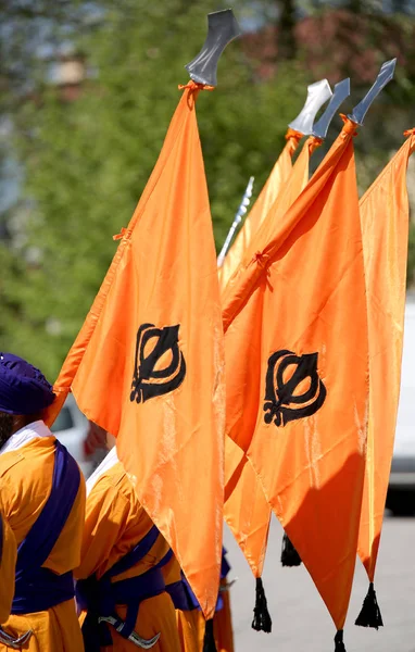 orange flag with symbol of Sikh called Khanda