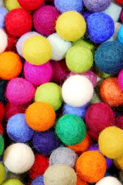 Many felt balls for sale as christmas ornaments — Stock Photo, Image