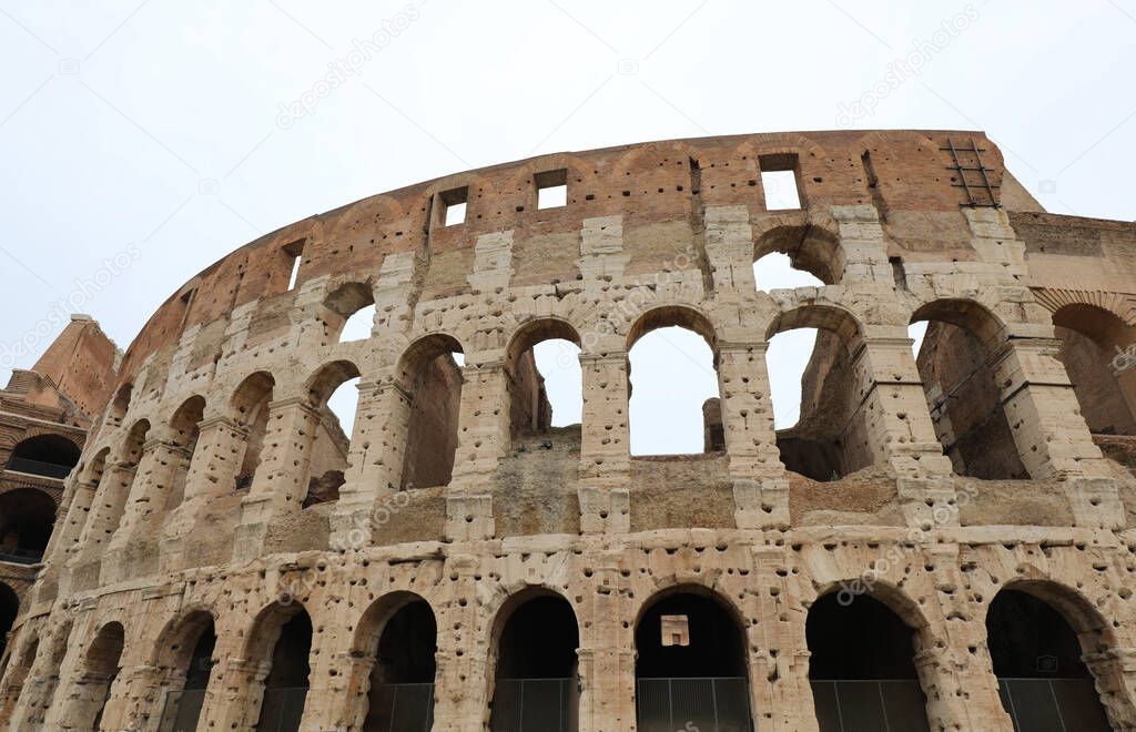 Colosseum in Rome and many holes in the walls made to recover th
