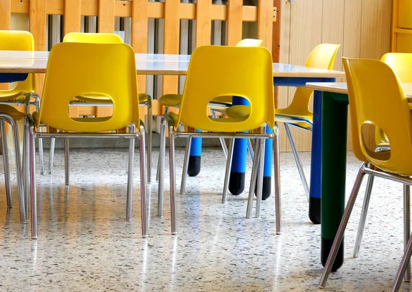 Yellow small chairs in the classroom — Stock Photo, Image