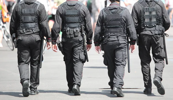 Four cops with uniform — Stock Photo, Image