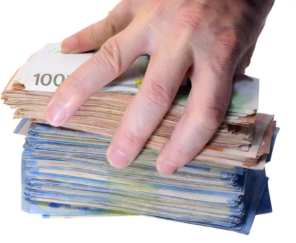 Hand of a man grabbing a huge pile of money — Stock Photo, Image