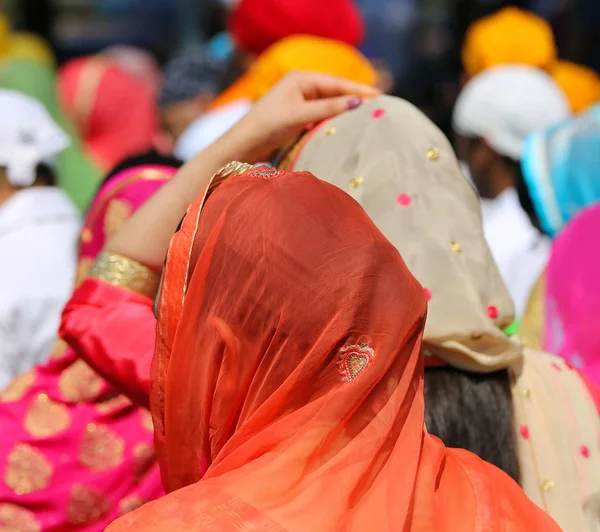 Women with heads covered with a colored veil — Stock Photo, Image