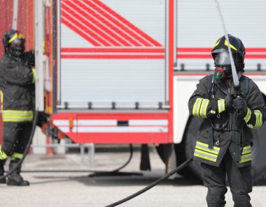 fireman with hose hydrant in action