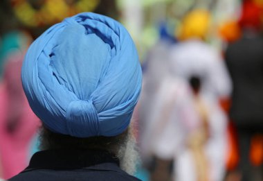 Senior bearded Sikh religion man with turbaned during the religi