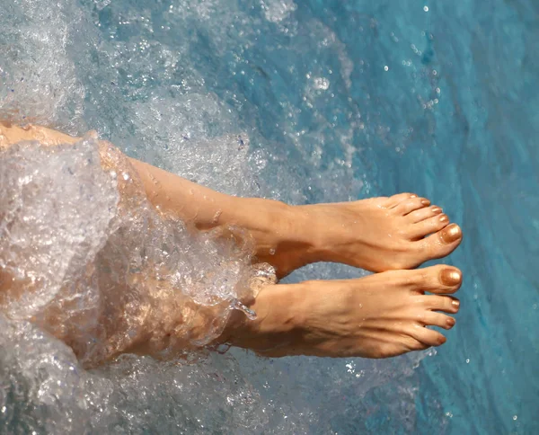 Hydromassage treatment for a barefoot woman with long legs — 스톡 사진