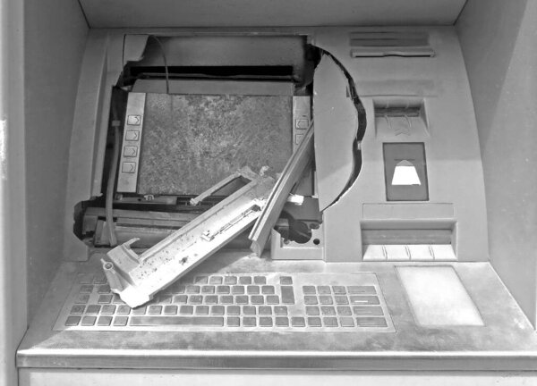 broken ATM machine in black and white