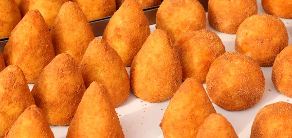 fried ball rice called ARANCINO in Italian Language for sale at the street food stall in southern Italy