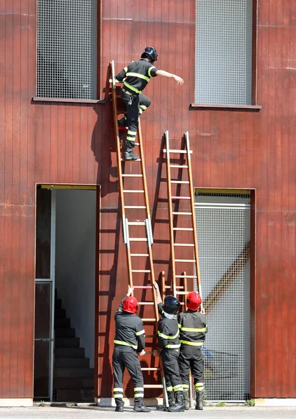 Firefighter Enters House Wooden Ladder Exercise Fire Station Emergency Team — Stock Photo, Image