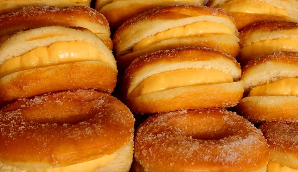Muitos Saborosos Donuts Açúcar Revestido Uma Pastelaria — Fotografia de Stock