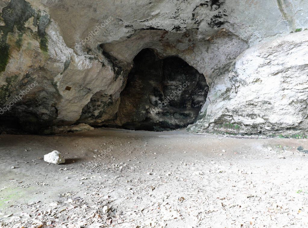 large cave inside the mountain used by primitive prehistoric men as a home and refuge
