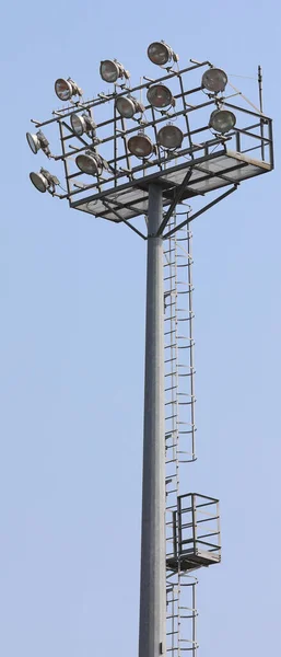 powerful industrial bright headlamps of an industrial plant of the stadium on a steel pylon