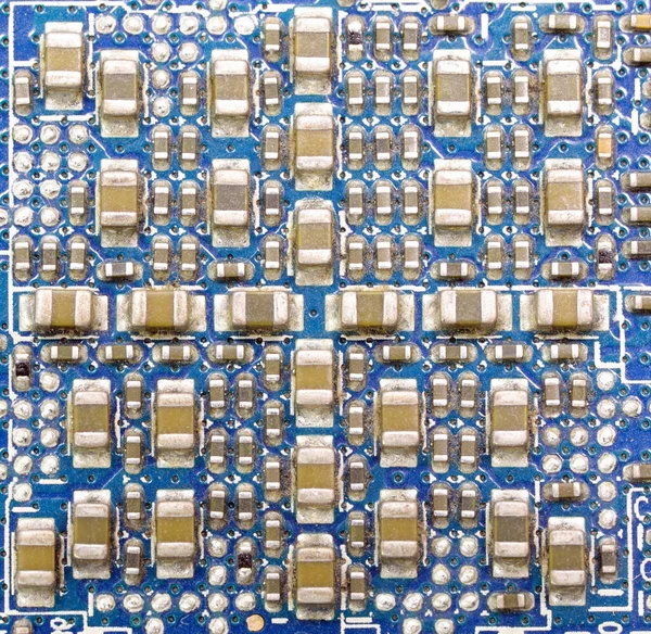 Makroaufnahmen Vieler Elektronischer Miniaturkomponenten Einer Hauptplatine — Stockfoto