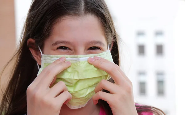 Little Girl Smiling Eyes Worries Fixes Green Surgical Mask Protection — Stock Photo, Image