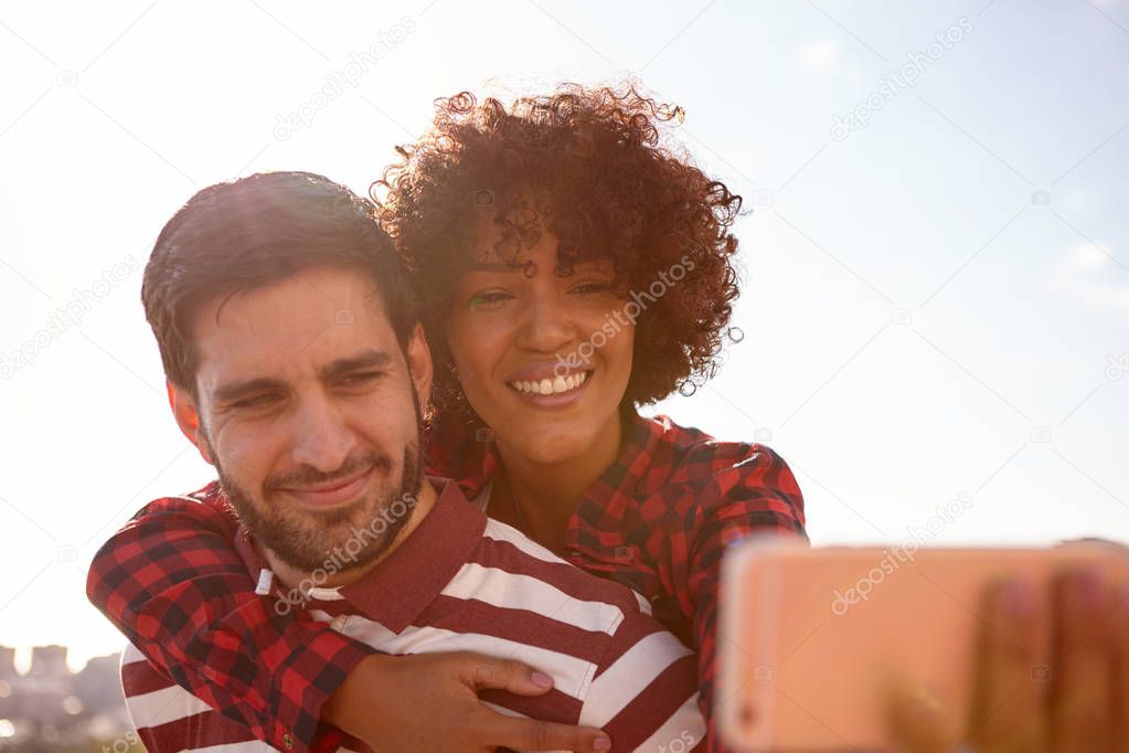 young couple taking selfie