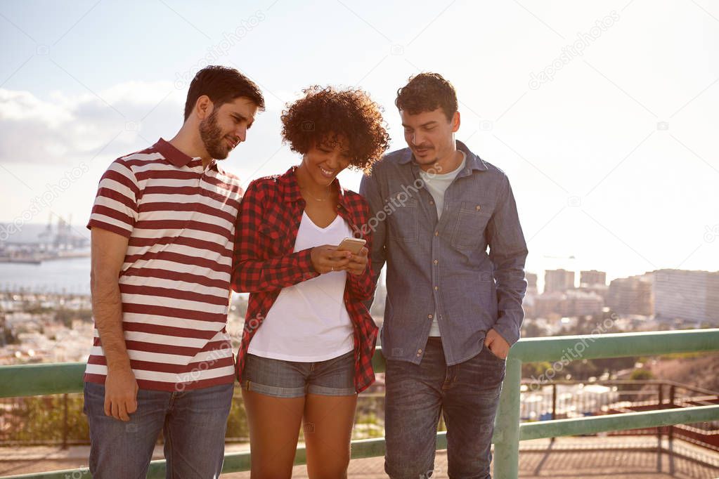 Girl and two guys reading messages