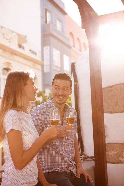 laughing couple drinking beers