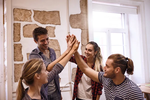 young people giving high five