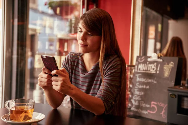 young woman looking at cell phone