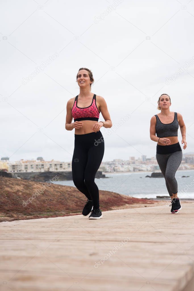 Young attractive females running  