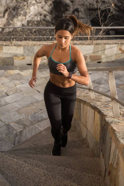 sporty young woman running