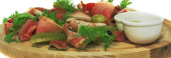 Meat slices with cucumber. on the wooden substrate. on isolated background — Stock Photo, Image