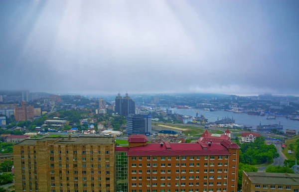 port city view from the heights, high Bay braced bridge, thick fog. Marine City