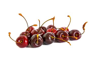 bir sürü beyaz bir arka plan üzerinde farklı tatlı kiraz,