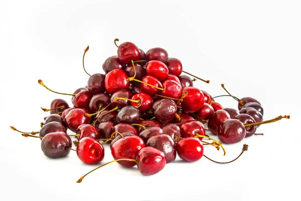 En massa olika sweet cherry på vit bakgrund, — Stockfoto