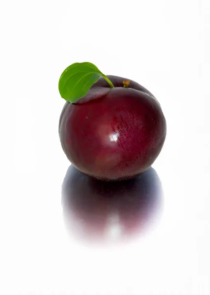 Plums on a big background, isolate. bright plums black or red without background. — Stock Photo, Image