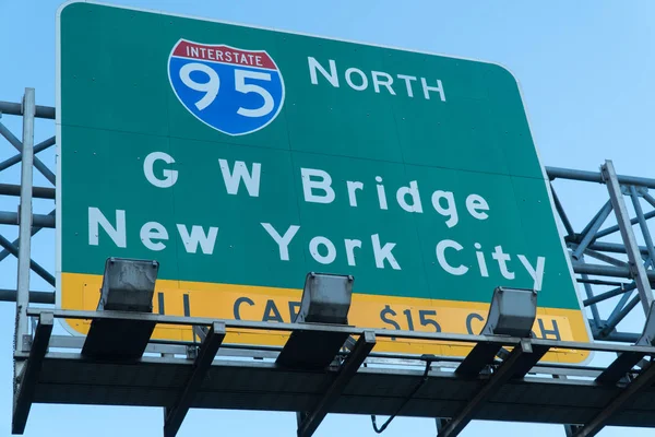 Directional highway road sign for George Washington Bridge toll plaza fee collection both into New York City from Jersey — Stock Photo, Image