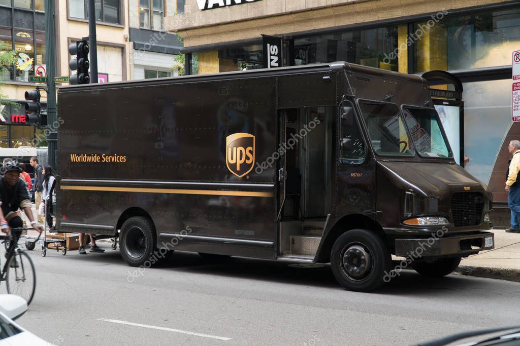 Chicago, USA - Circa 2019: United Parcel Service UPS famous brown logo truck parked on city street deliver package to local business and residence