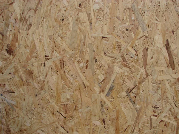 Gros plan fond de panneau en bois pressé, texture sans couture de panneau de brin orienté - OSB bois — Photo