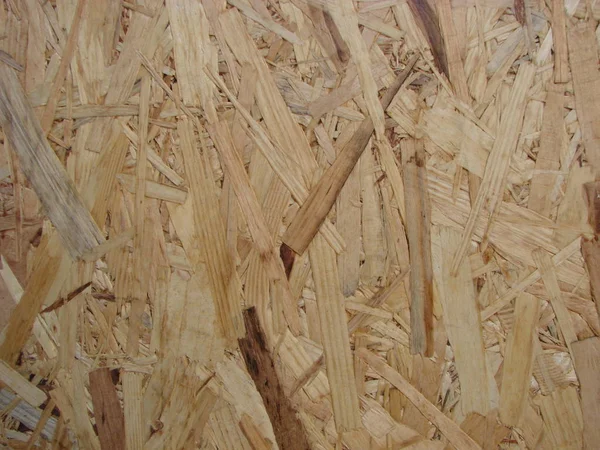Fondo pannello in legno pressato da vicino, trama senza cuciture di bordo filo orientato - OSB legno — Foto Stock