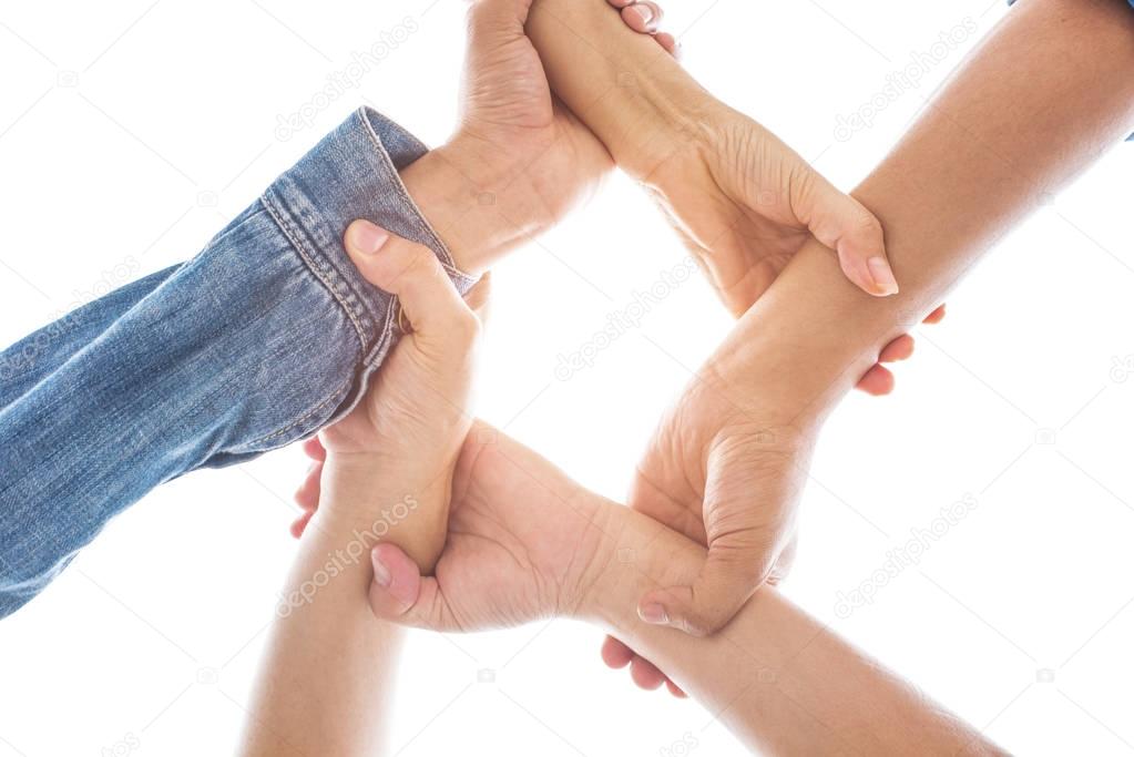 Hands in grabbing and holding wrist together in world unity and peace cooperation background isolated white background with sun light. Peaceful and sign concept