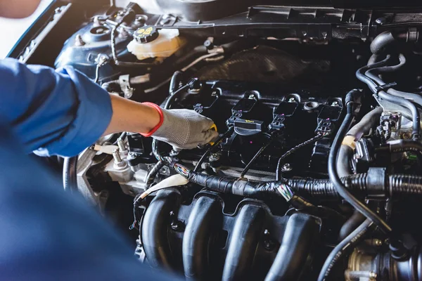 Car mechanic holding checking gear oil to maintenance vehicle by — 스톡 사진