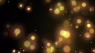 Kusursuz bir döngü. Soyut parlak küre altın ve sarı parçacık gökyüzünden siyah arka plana düşüyor. Arkaplan ve etki konsepti. 4K görüntüler video hareketli grafik tasarım ögesi. 