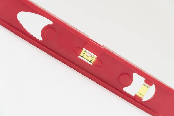 Red level tool used for determinig the level of a surface for construction . — Stock Photo, Image