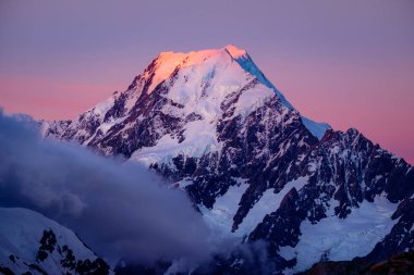 Scenic view of Mt Cook summit at colorful sunset, NZ clipart