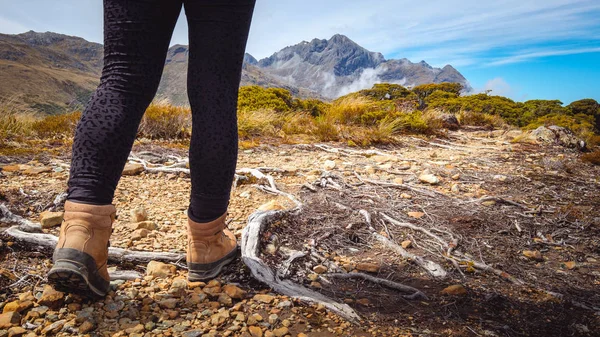 Detail of woman trekking on mountain track, New Zealand — Stock Photo, Image
