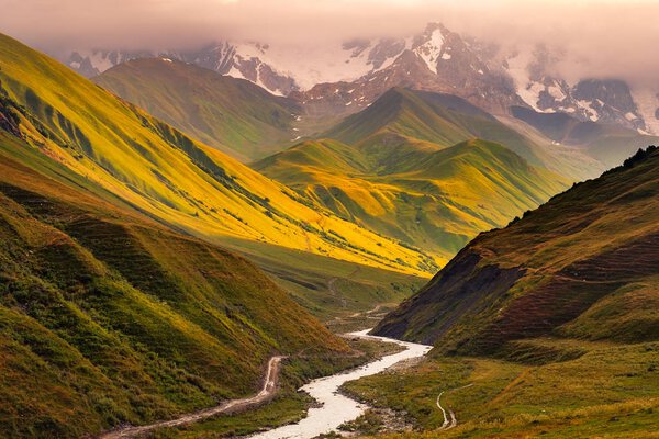 Beautiful sunrise with mountains, river and meadows in Ushguli, Svaneti national park, Country of Georgia