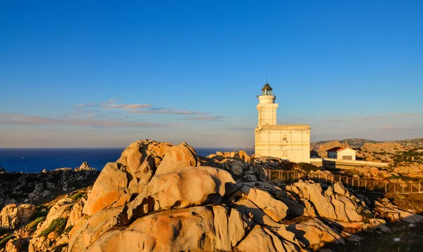 Rocky ocean coastline landscape view with lighthouse — Stock Photo, Image