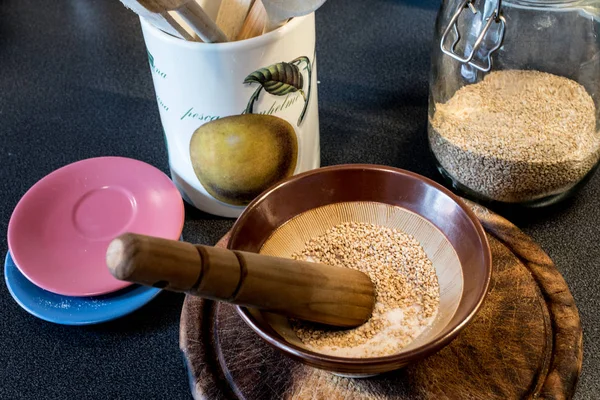 gomasio, made of sesame seeds and hymalaian pink salt, suribachi and surikogi macrobiotic diet tools