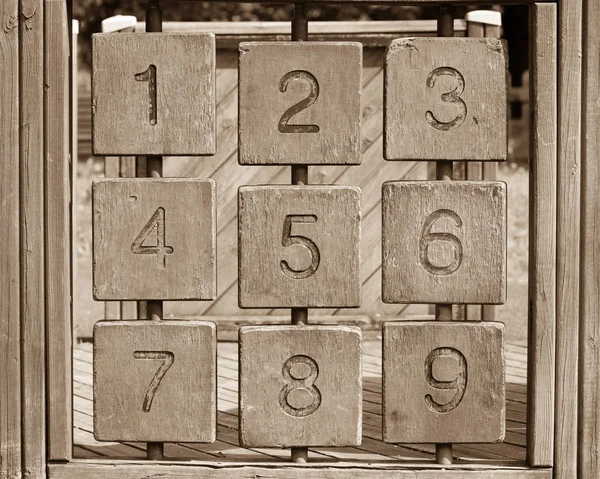 tris game with arabic numbers, sepia version