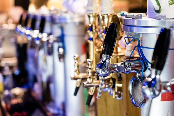 different beer pumps, selective focus and bokeh