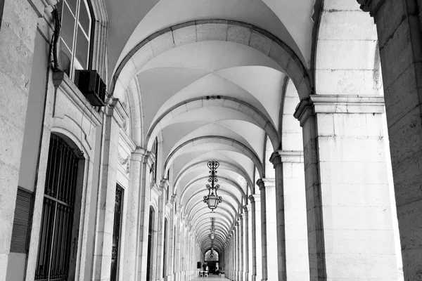 typical covered walkway, the portico of placa do comercio, lisbo