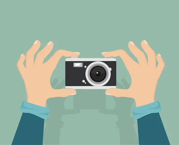 Fotocamera con mano tenerlo — Vettoriale Stock